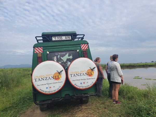 Three women looking at a lake in Tanzania