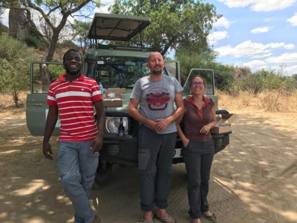3 people with car